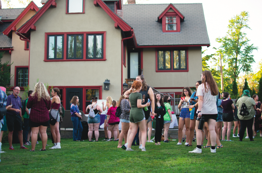 A dessert reception at President Dr. David Finegolds house. First-year students and others gathered to mingle in late August. Photo Credit: Lily Kubit