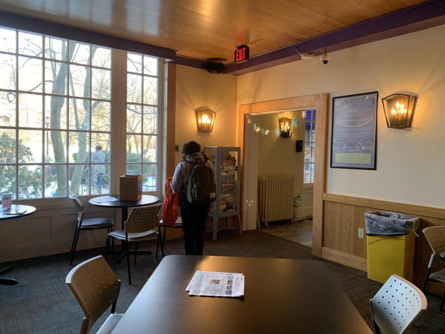 A student stands in the Carriage House lounge, one of the indoor common areas on Chatham’s Shadyside campus. Photo Credit: Abbey Sullivan
