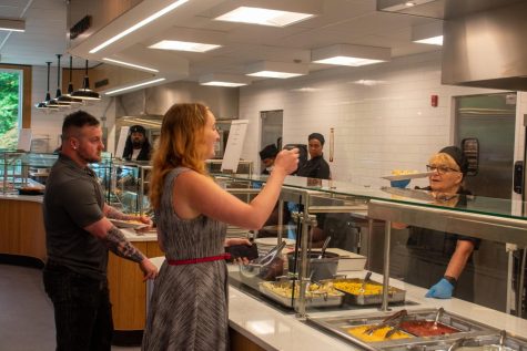 Anderson Dining Hall employees serve lunch during the grand opening on Aug. 16. Photo credit: Lilly Kubit
