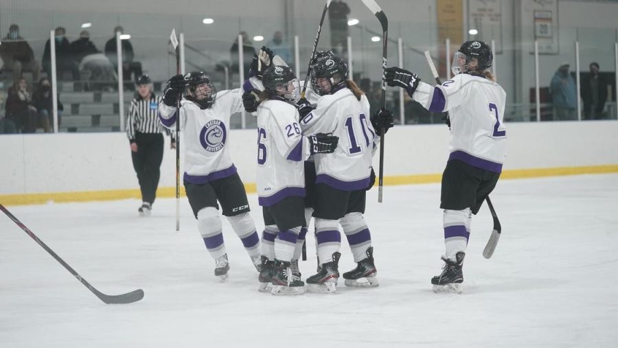 The+womens+ice+hockey+team+celebrating+a+goal+during+the+2021-22+season.+Photo+Credit%3A+Chatham+Athletics
