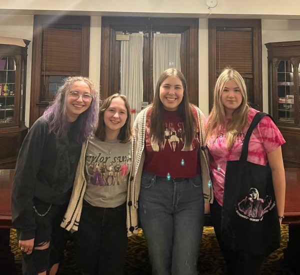 From left, members of Chatham (Taylors Version) Rosie Wick 27,Tiana Eicher 27, Cameron Berloffe 27 and Avery Dye 27 wear Taylor Swift merch.