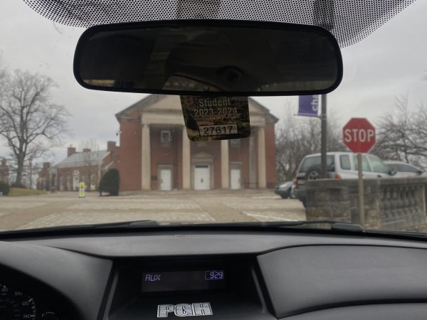 Car dashboard displaying student parking pass at the Campbell Memorial Chapel. 