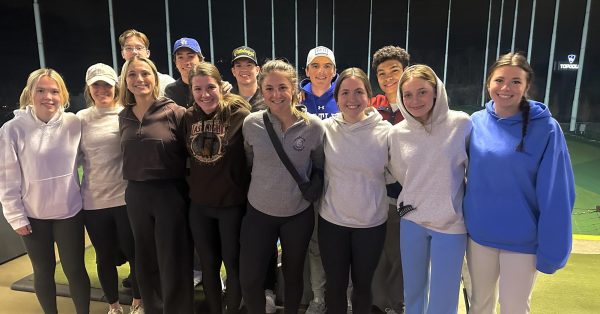 Members of the golf club at Topgolf event.