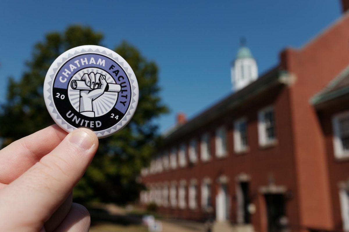 Chatham Faculty United Pin in front of Braun Hall.