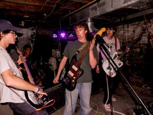 From left to right: Lukas Clement, 18; Liam Taylor, 18; Logan Baxter, 19; and Michael Adams of Kwarter Zip performing at Kame House.