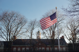 American flag flying over Falk Hall.