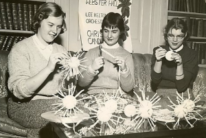 Students make decorations for the 1955 Holiday Ball. Photo credit: Chatham University Archives