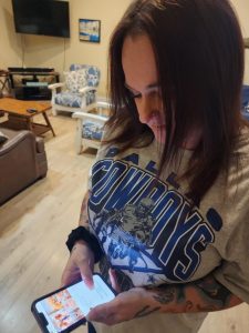 Deanna Jenkins, Jada Jenkins' mother, scrolls through the Chatham University Parents Facebook group. Photo courtesy of Deanna Jenkins.