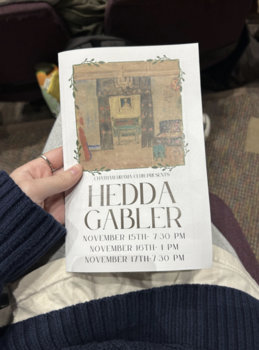 The program manual for "Hedda Gabler" offers a look into the production's artistic vision and themes.