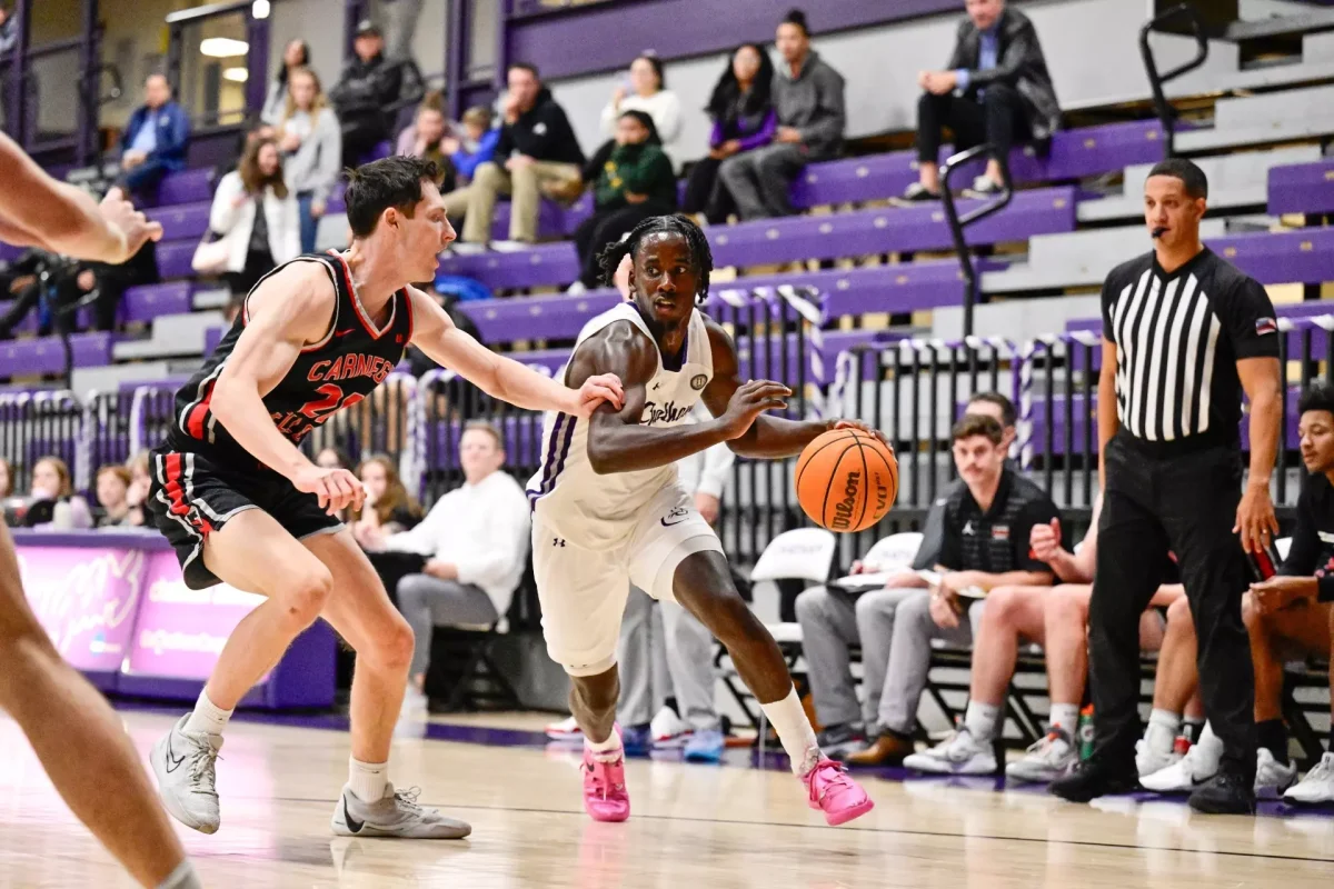 Simon Boyer '25 plays offense against opposing team. Photo credit: Chatham Athletics 