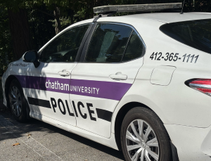 A Chatham University police car parked by Rea Garage.