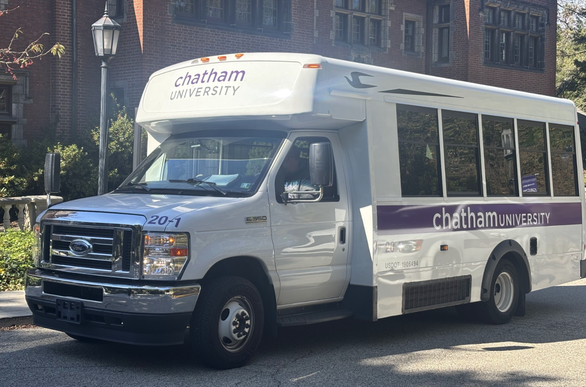 A Chatham University shuttle sits outside of the Mellon Center.