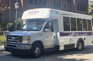 A Chatham University shuttle sits outside of the Mellon Center.