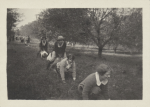 Jean S. MacColl 1925, center on ground and friends play leapfrog on the Allen Farm during Mountain Day, 1923. All photos and information courtesy of the JKM library archives.