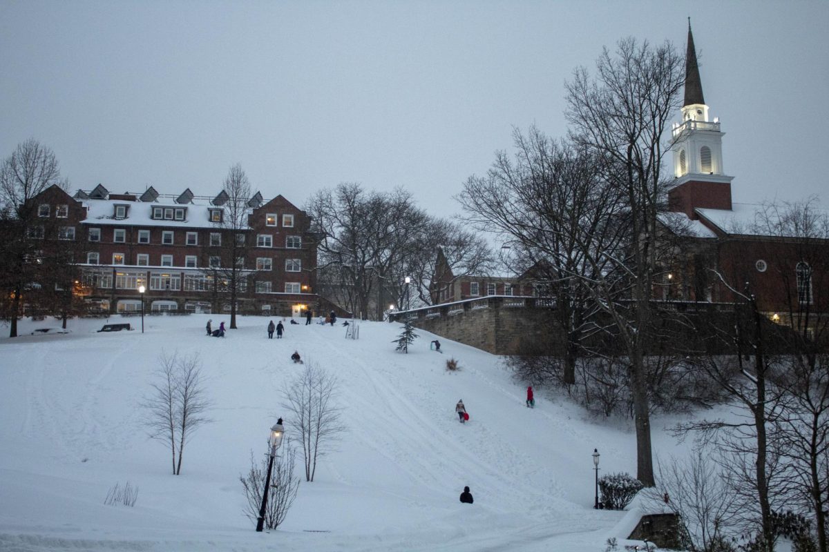 Students play and sled together on Chapel Hill. Sledding on Chapel Hill has been banned on campus since January of 2023.