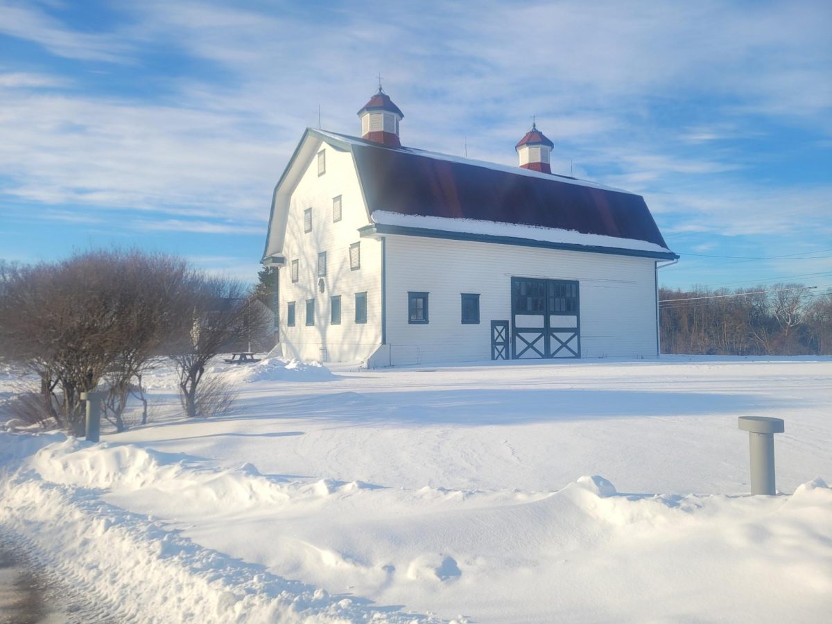 Blue skies overlook the barn on Chatham's Eden Hall campus. 