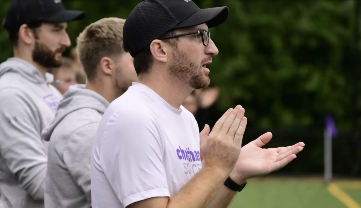 Coach Keith Danley cheers on athletes. Photo credit: Chatham Athletics