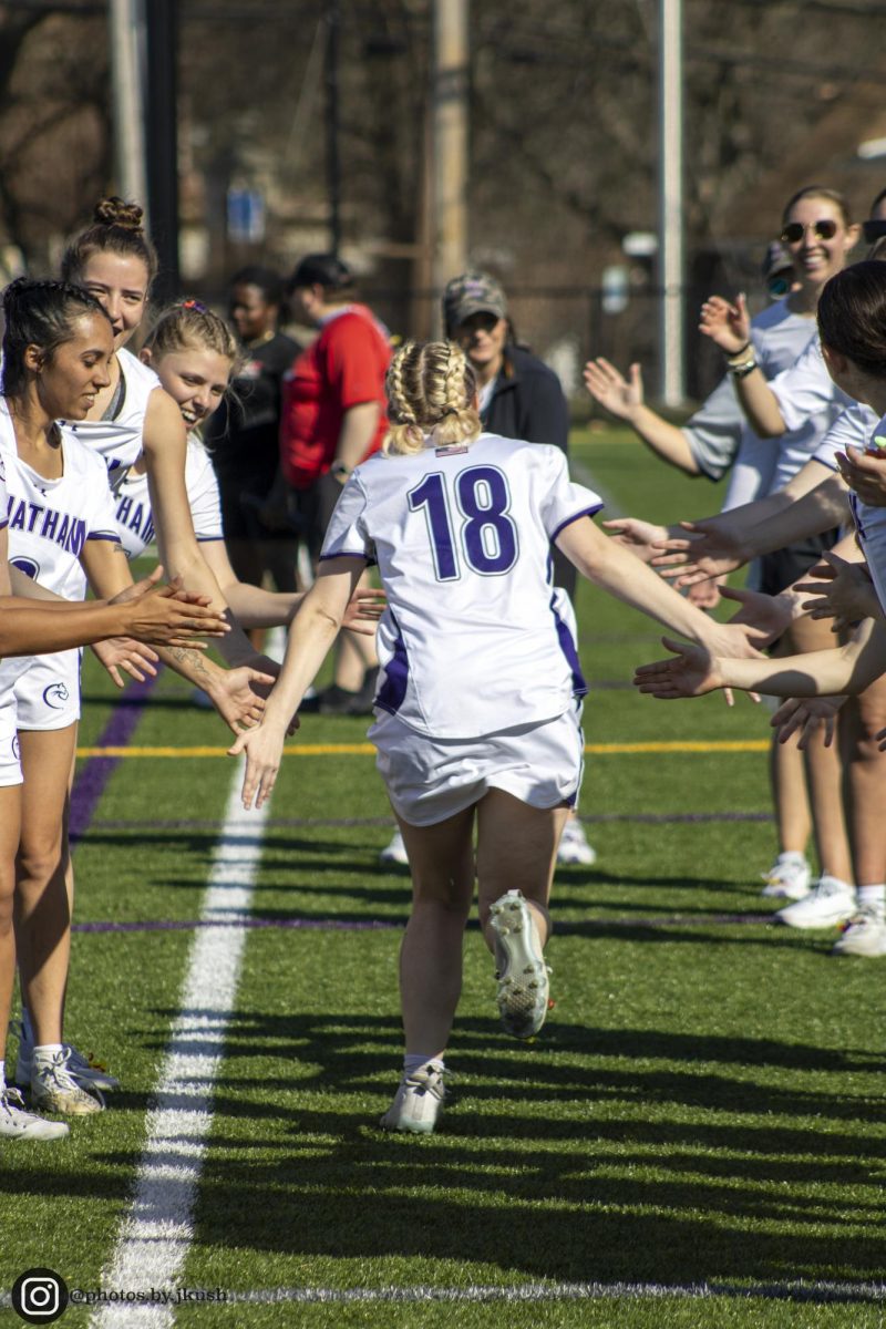 Becca Baker ‘26 during pregame runout. 